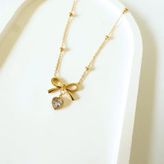 Charmed Bow & Heart Gold Necklace