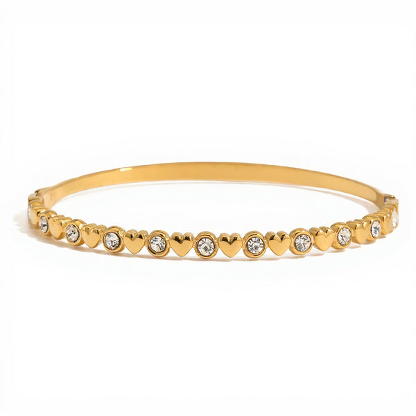 Gold bracelet with heart-shaped beads on a white background