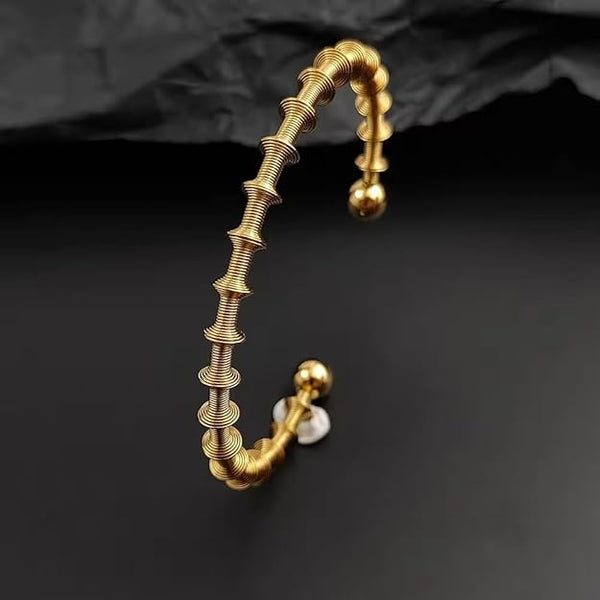 Orbit Coil Statement Bangle
