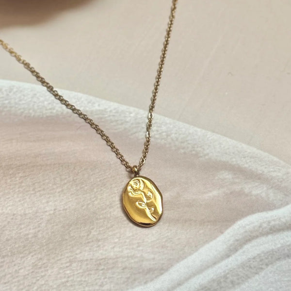 Sculpted Muse Gold Plated Necklace – Artful Face & Flower Medallion