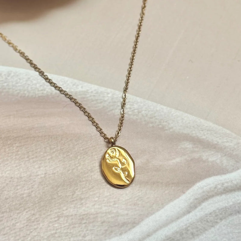 Sculpted Muse Gold Plated Necklace – Artful Face & Flower Medallion