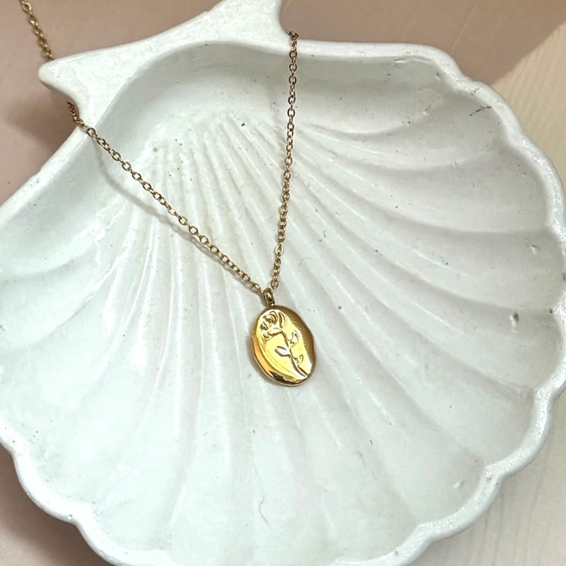 Sculpted Muse Gold Plated Necklace – Artful Face & Flower Medallion